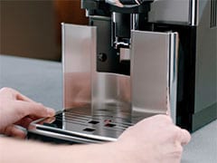 Message « vider le bac à marc de café » sur la machine espresso Philips Saeco