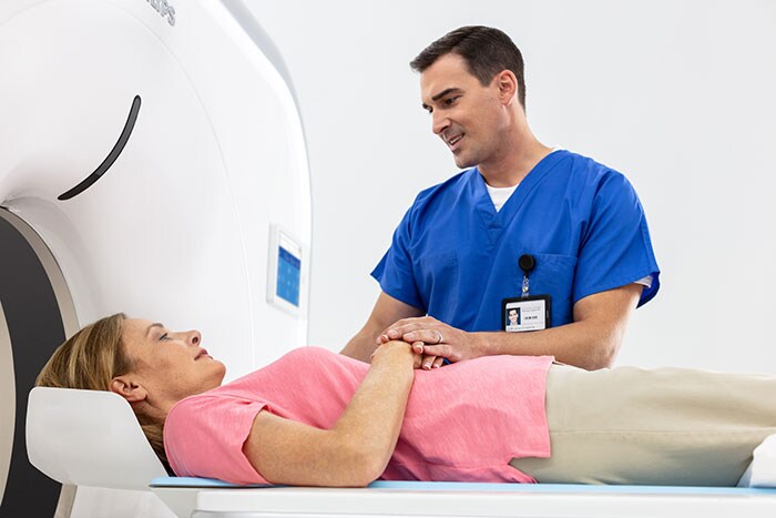 The Philips Incisive CT with patient and technician.